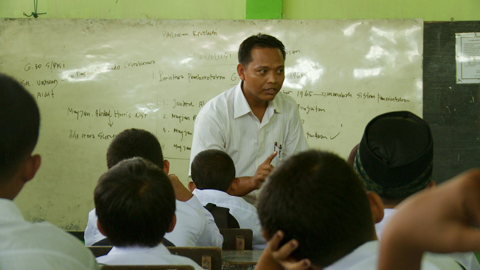 A teacher propagates the existing rhetoric on the Indonesian genocide to his pupils in Drafthouse Films’ and Participant Media’s The Look of Silence. Courtesy of Drafthouse Films and Participant Media.
